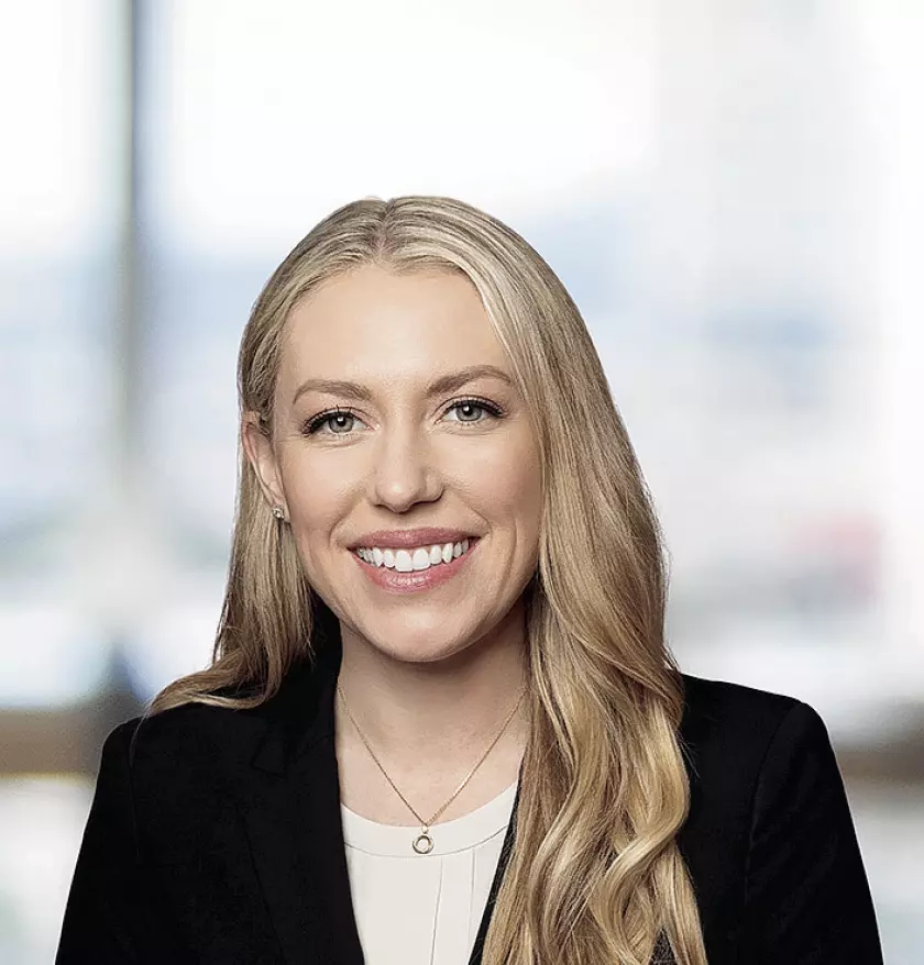 Kelly M. Raney, Partner at Greenberg Glusker LLP see with a bright smile on her face